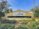 Westyn Bay community entrance with an inviting landscape design, including colorful flowers and lush greenery at 920 Nola Dr, Ocoee, FL 34761