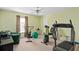 Exercise room equipped with a treadmill, stationary bike, and ample space at 920 Nola Dr, Ocoee, FL 34761