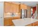 Kitchen featuring stainless steel appliances, wooden cabinets, and center island at 920 Nola Dr, Ocoee, FL 34761