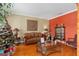Cozy living room with hardwood floors, decorative accents, and a Christmas tree at 920 Nola Dr, Ocoee, FL 34761