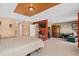 Spacious bedroom featuring a tray ceiling, seating area, and mounted television for comfortable, modern living at 920 Nola Dr, Ocoee, FL 34761