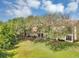 Aerial shot of condo buildings surrounded by mature trees and well-maintained grounds at 980 Mooring Ave # 105, Altamonte Springs, FL 32714