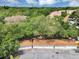 Aerial view of garages with red tile roofs surrounded by lush greenery at 980 Mooring Ave # 105, Altamonte Springs, FL 32714