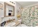Bathroom featuring granite countertops and a leafy shower curtain at 980 Mooring Ave # 105, Altamonte Springs, FL 32714