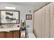 Cozy bathroom with polka dot shower curtain, decorative ladder, and single sink vanity at 980 Mooring Ave # 105, Altamonte Springs, FL 32714
