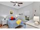 Cozy bedroom featuring a ceiling fan, bright window, and decoratively furnished with a playful feel at 980 Mooring Ave # 105, Altamonte Springs, FL 32714