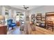 Bright dining room with natural light, wood floors, a ceiling fan, and open shelving at 980 Mooring Ave # 105, Altamonte Springs, FL 32714
