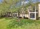Charming condo with well-maintained landscaping, screened lanai, and lush green lawn at 980 Mooring Ave # 105, Altamonte Springs, FL 32714