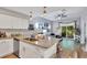 Stylish kitchen with granite countertops, subway tile backsplash, and seamlessly transitions to living area at 980 Mooring Ave # 105, Altamonte Springs, FL 32714