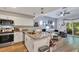 Charming kitchen boasts granite countertops, stainless appliances, and an open layout into the living area at 980 Mooring Ave # 105, Altamonte Springs, FL 32714