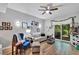 Comfortable living room with wood floors, a sliding glass door, and stylish furnishings at 980 Mooring Ave # 105, Altamonte Springs, FL 32714