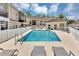 Community pool area surrounded by lounge chairs and well-maintained landscaping, ideal for relaxation at 980 Mooring Ave # 105, Altamonte Springs, FL 32714