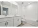 Modern bathroom featuring a double vanity, tiled floors and shower over tub at 4532 Windy Oak Way, St Cloud, FL 34772