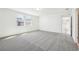 Spacious bedroom with plush carpet, windows for natural light, and access to the en suite at 4532 Windy Oak Way, St Cloud, FL 34772