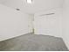 Neutral bedroom with soft carpeting and a closet with sliding paneled doors at 4532 Windy Oak Way, St Cloud, FL 34772