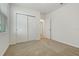 Bedroom features neutral carpet, white walls, a window with blinds, and double door closet at 4532 Windy Oak Way, St Cloud, FL 34772