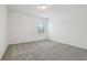 Neutral bedroom with plush carpeting, a window with blinds, and white walls at 4532 Windy Oak Way, St Cloud, FL 34772