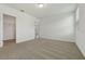 Bright bedroom with neutral carpeting, a window with blinds, and a doorway to the closet at 4532 Windy Oak Way, St Cloud, FL 34772