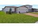 Attractive single-Gathering home with a brick-paved driveway and well-kept front lawn at 4532 Windy Oak Way, St Cloud, FL 34772