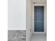 The entryway to this home features a solid blue front door and stone accents at 4532 Windy Oak Way, St Cloud, FL 34772