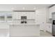 Modern kitchen with stainless steel appliances, a large island, and plenty of cabinet space at 4532 Windy Oak Way, St Cloud, FL 34772
