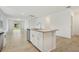 Open floor plan kitchen with a granite countertop island, stainless steel appliances, and natural light at 4532 Windy Oak Way, St Cloud, FL 34772