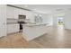 A modern kitchen with stainless steel appliances, granite countertops, and a central island at 4532 Windy Oak Way, St Cloud, FL 34772