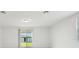 The room features an empty space with large windows and a sliding glass door at 4532 Windy Oak Way, St Cloud, FL 34772