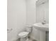 A well-lit half bath with a pedestal sink and modern fixtures at 4532 Windy Oak Way, St Cloud, FL 34772