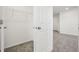 An organized walk-in closet providing ample storage with metal racks, shelving, and plush carpeting at 4532 Windy Oak Way, St Cloud, FL 34772