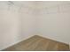 Interior view of a walk-in closet with wire shelving and neutral carpeting at 4532 Windy Oak Way, St Cloud, FL 34772