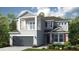 Charming two-story home with grey siding, red shutters, a covered balcony, and a two-car garage at 4716 Coral Harbour Rd, Kissimmee, FL 34758