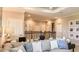 Beautiful living room and upstairs space featuring cozy seating and railing overlook at 4716 Coral Harbour Rd, Kissimmee, FL 34758