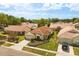 Single-story home with a tile roof in a quiet neighborhood has mature landscaping and a paver driveway at 618 Via Milano, Apopka, FL 32712