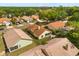 Aerial view of a neighborhood featuring many homes with orange tile roofs and mature trees at 618 Via Milano, Apopka, FL 32712