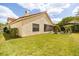 Spacious backyard features lush green lawn, fire pit, and partial fence at 618 Via Milano, Apopka, FL 32712
