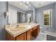Well-lit bathroom featuring a large vanity and a window at 618 Via Milano, Apopka, FL 32712