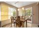 Bright dining area with sliding glass doors to the outdoor patio and backyard at 618 Via Milano, Apopka, FL 32712