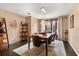 Open dining room with stylish light fixture and a bar at 618 Via Milano, Apopka, FL 32712