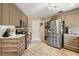Bright kitchen with stainless steel appliances, tile flooring and modern countertops at 618 Via Milano, Apopka, FL 32712