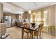 Bright kitchen/dining area with tile floors and stainless steel appliances at 618 Via Milano, Apopka, FL 32712