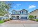 Beautiful two-story home with a large driveway and well-maintained landscaping at 7503 Marker Ave, Kissimmee, FL 34747
