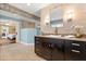 Bright bathroom with elegant tile accents, a modern vanity, and an open shower space at 7849 Georgeann St, Winter Park, FL 32792