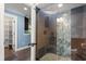 Nicely designed bathroom with an enclosed glass shower and ample storage cabinets at 7849 Georgeann St, Winter Park, FL 32792
