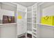 Walk-in closet featuring custom shelving and drawer units for ample storage at 7849 Georgeann St, Winter Park, FL 32792