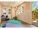Bright interior with natural wood walls, large windows, and space for yoga at 7849 Georgeann St, Winter Park, FL 32792