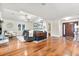 Inviting living room with hardwood floors, tray ceiling, and stylish decor at 7849 Georgeann St, Winter Park, FL 32792