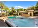 A backyard oasis with a pool, hot tub, and covered bar area perfect for entertaining at 7849 Georgeann St, Winter Park, FL 32792