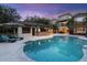 An expansive pool and bar area perfect for entertaining, with beautiful landscaping at 7849 Georgeann St, Winter Park, FL 32792