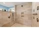 Spacious walk-in shower with rainfall showerhead, handheld shower, and built-in niche at 7849 Georgeann St, Winter Park, FL 32792